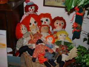 Mother made all these dolls. My 74 year old doll is the one in the middle with blue eyes.